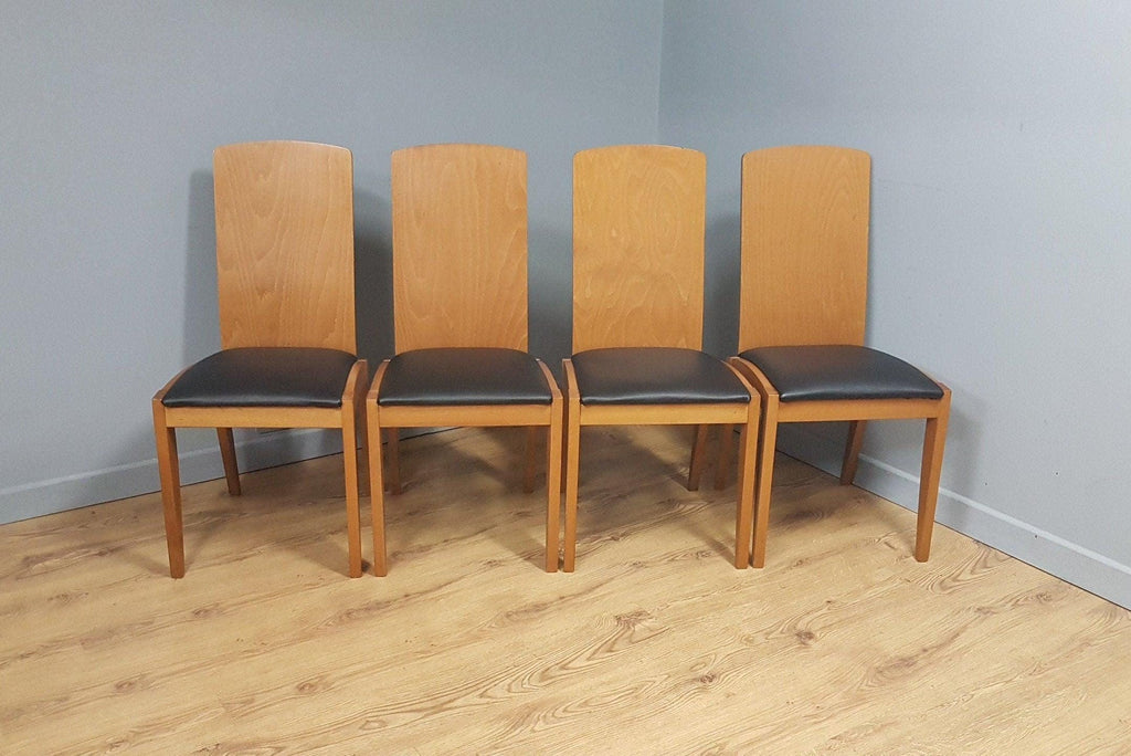 Four High Back Black Leatherette Dining Chairs