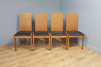 Four High Back Black Leatherette Dining Chairs