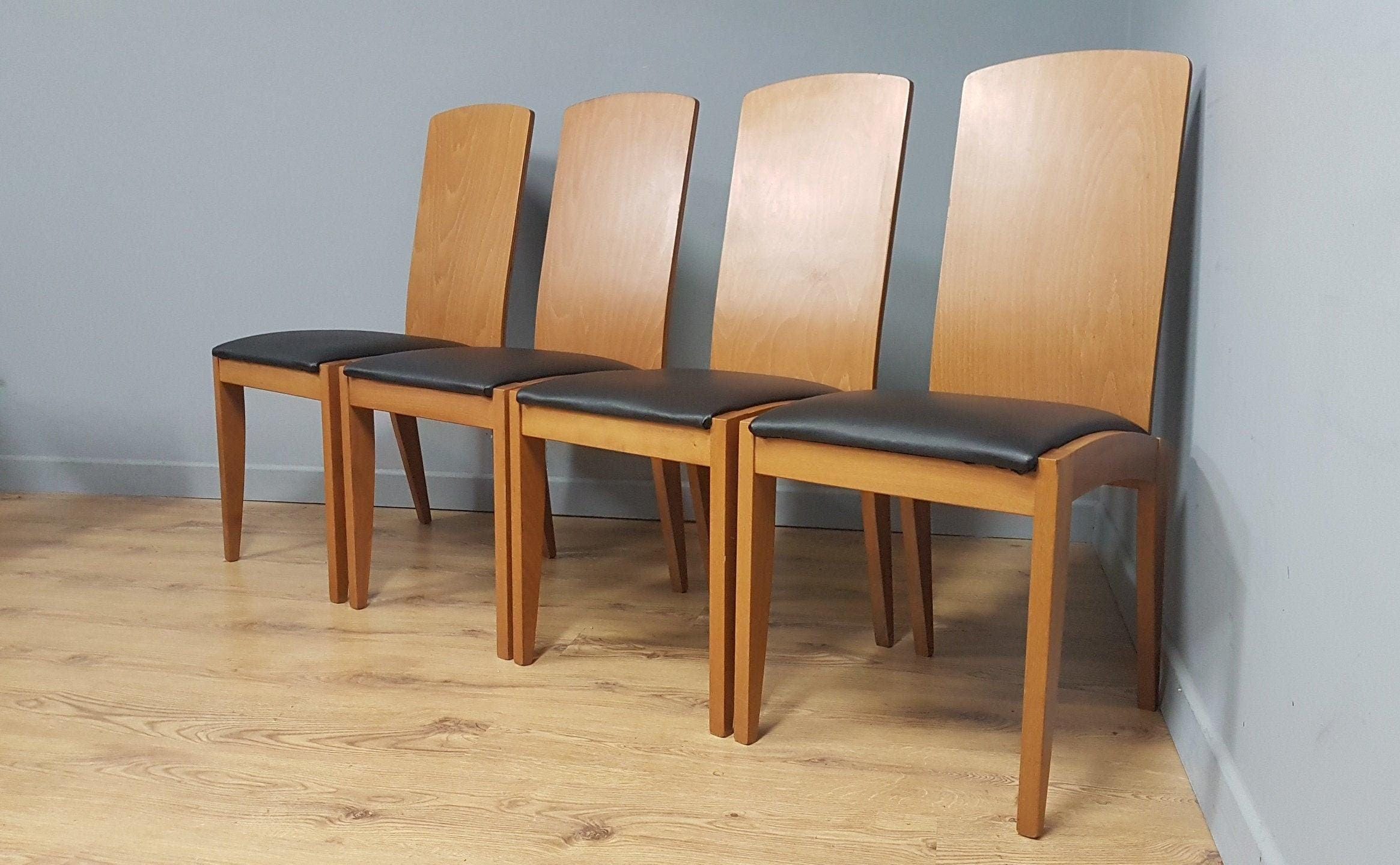 Four High Back Black Leatherette Dining Chairs