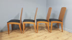 Four High Back Black Leatherette Dining Chairs