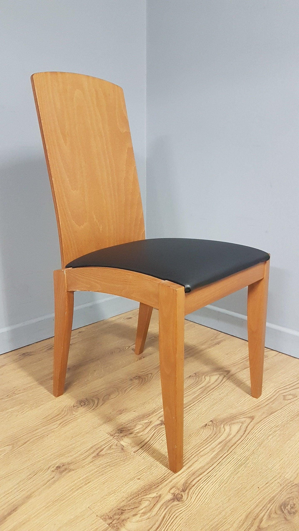 Four High Back Black Leatherette Dining Chairs
