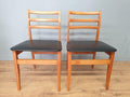 Two Mid Century Danish Influenced Teak Style Black Vinyl Pad Dining Chairs