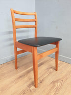 Two Mid Century Danish Influenced Teak Style Black Vinyl Pad Dining Chairs