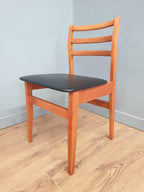 Two Mid Century Danish Influenced Teak Style Black Vinyl Pad Dining Chairs
