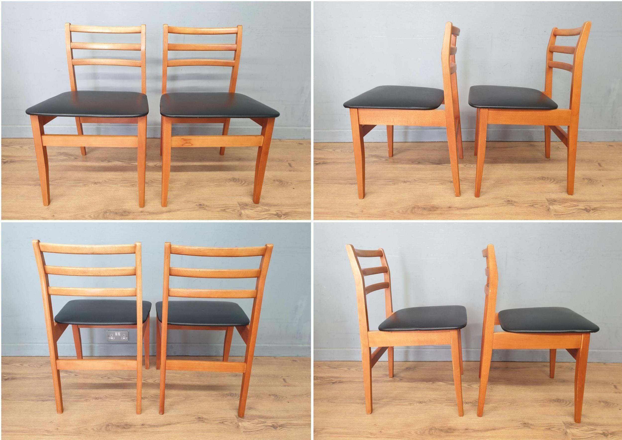 Two Mid Century Danish Influenced Teak Style Black Vinyl Pad Dining Chairs