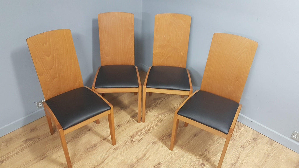 Four High Back Black Leatherette Dining Chairs