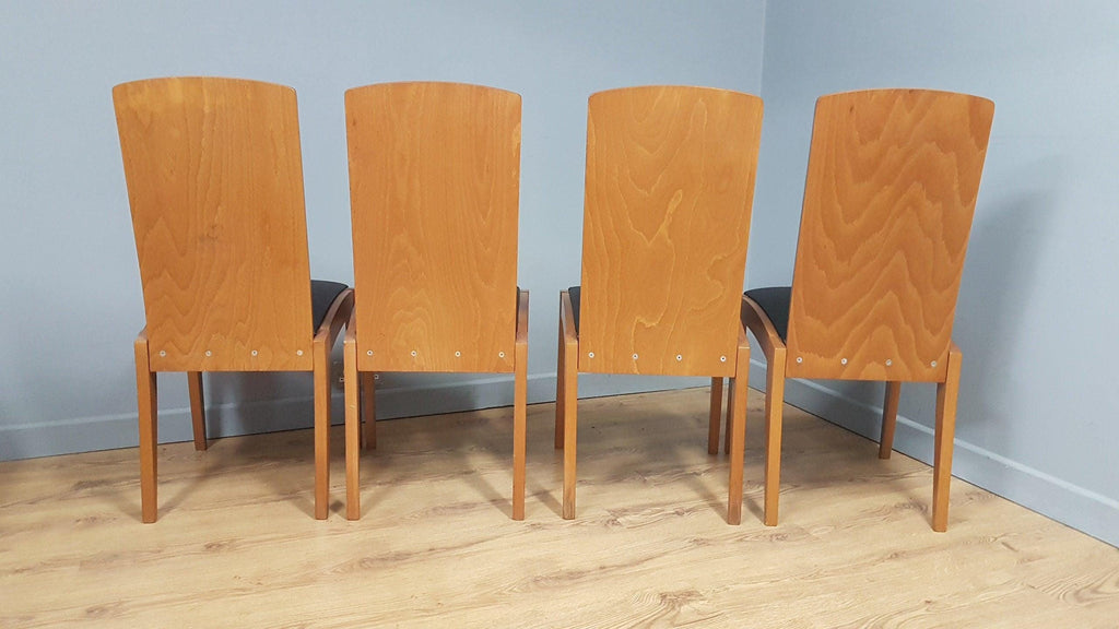 Four High Back Black Leatherette Dining Chairs