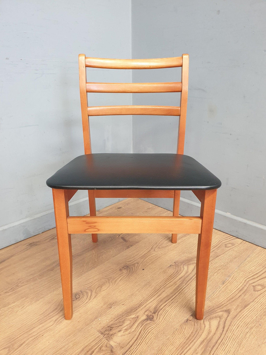 Two Mid Century Danish Influenced Teak Style Black Vinyl Pad Dining Chairs