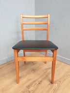 Two Mid Century Danish Influenced Teak Style Black Vinyl Pad Dining Chairs