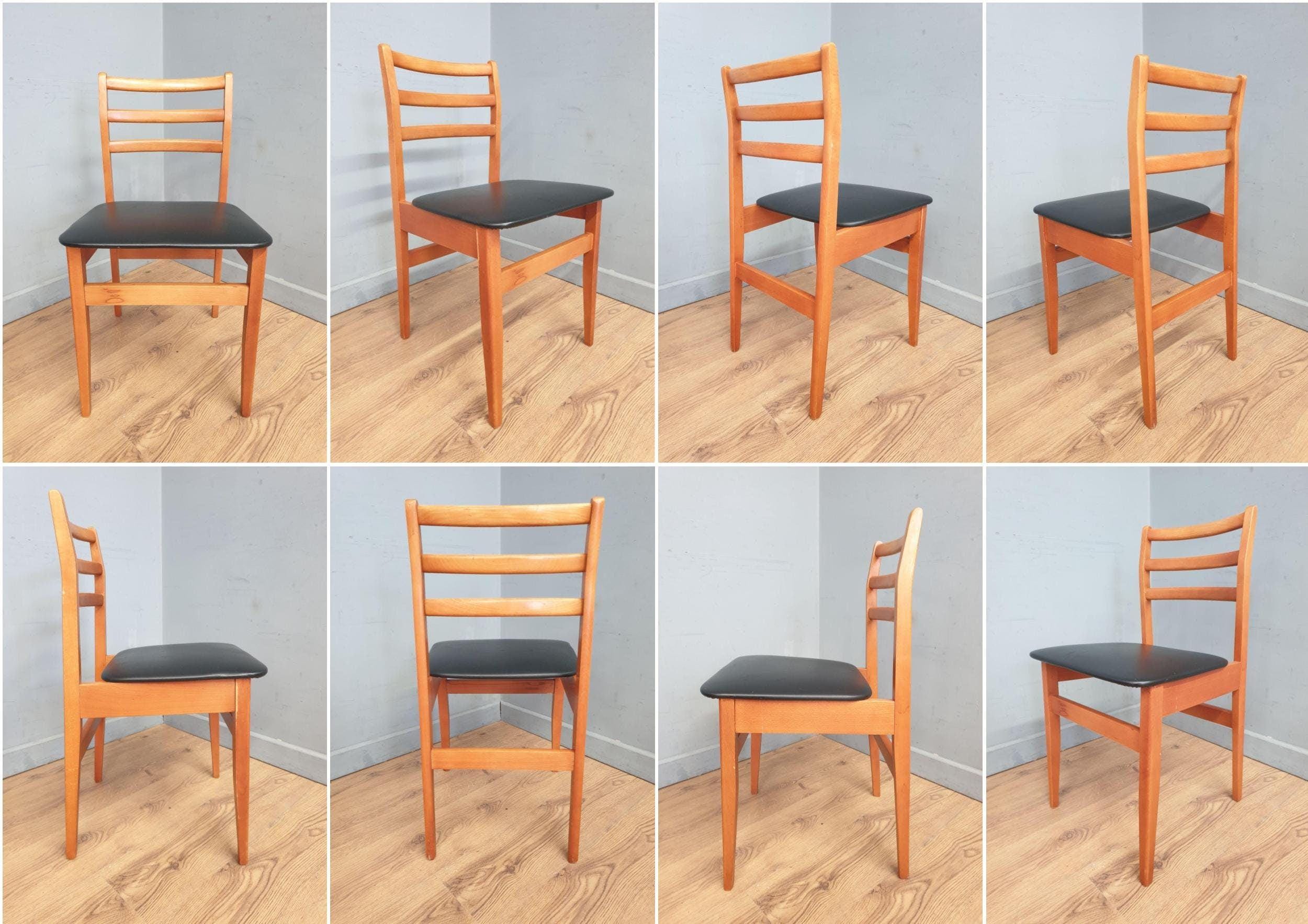 Two Mid Century Danish Influenced Teak Style Black Vinyl Pad Dining Chairs