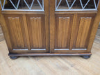 Oak Glazed Bookcase Leaded Glass Jacobean Revival Linen Fold Cabinet