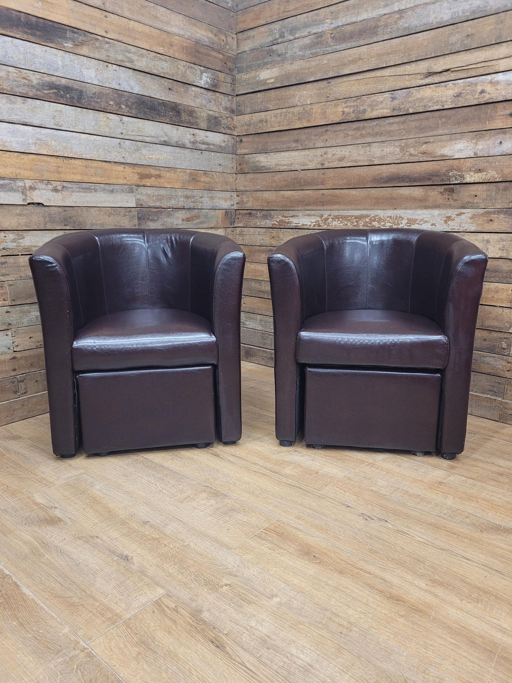 Pair Brown Faux Leather Tub Chairs With Matching Footstools