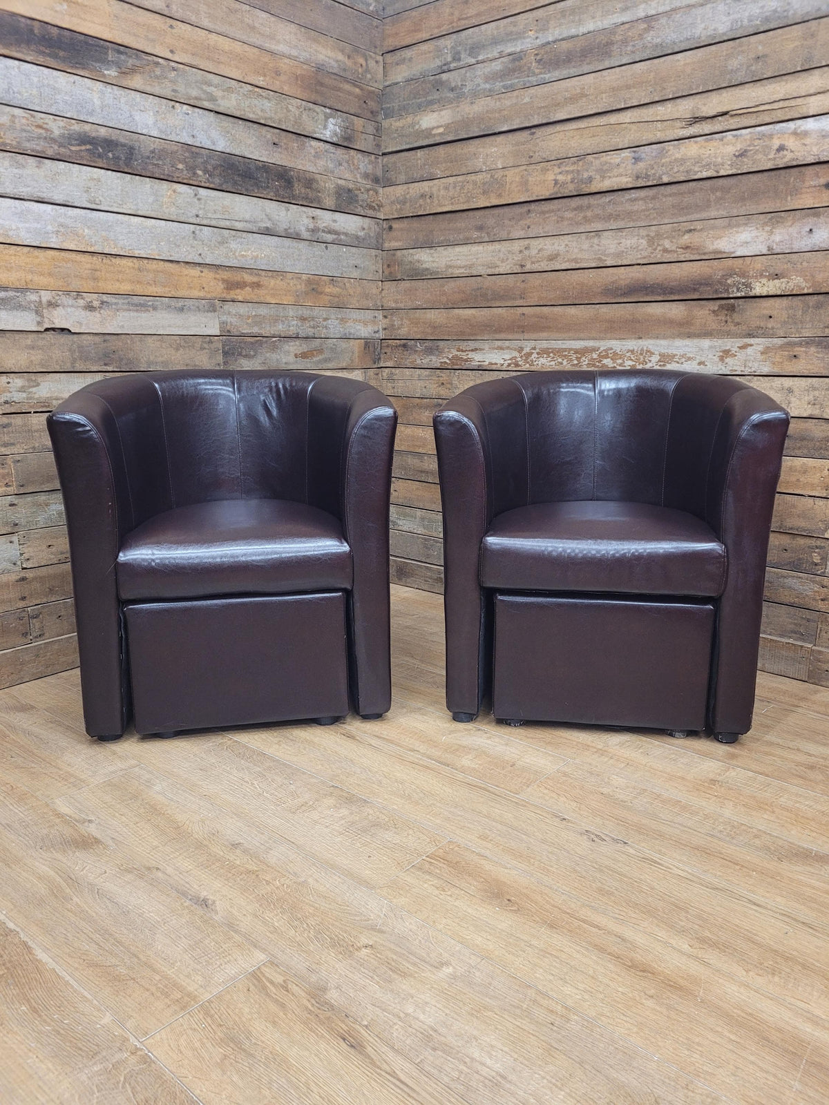 Pair Brown Faux Leather Tub Chairs With Matching Footstools