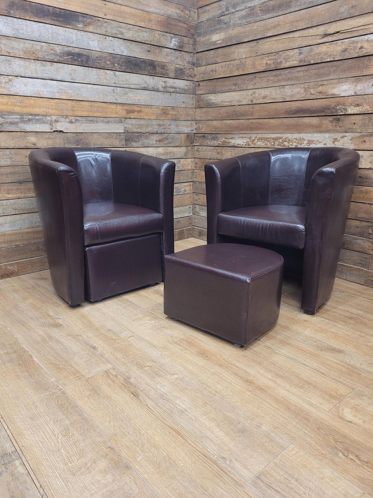 Pair Brown Faux Leather Tub Chairs With Matching Footstools
